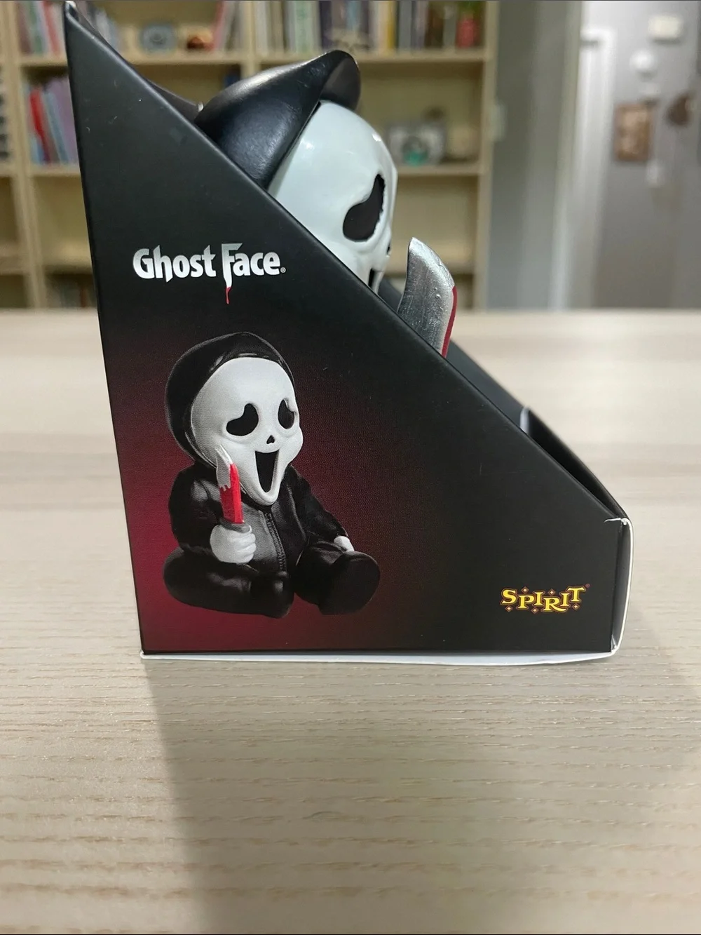 Spirit Ghost Face Figure in Black and White with Red-Accented Knife